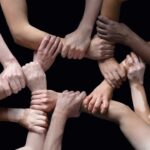 arms-linked-teamwork-istock-1282300189