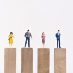 business-man-woman-sitting-equal-pieces-wooden