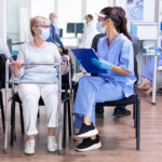 Handicapped senior woman with walking frame